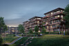 Moderne boligblokker med balkonger og belysning ved en grønn park med gangstier og mennesker.