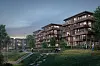 Moderne boligblokker med balkonger og belysning ved en grønn park med gangstier og mennesker.